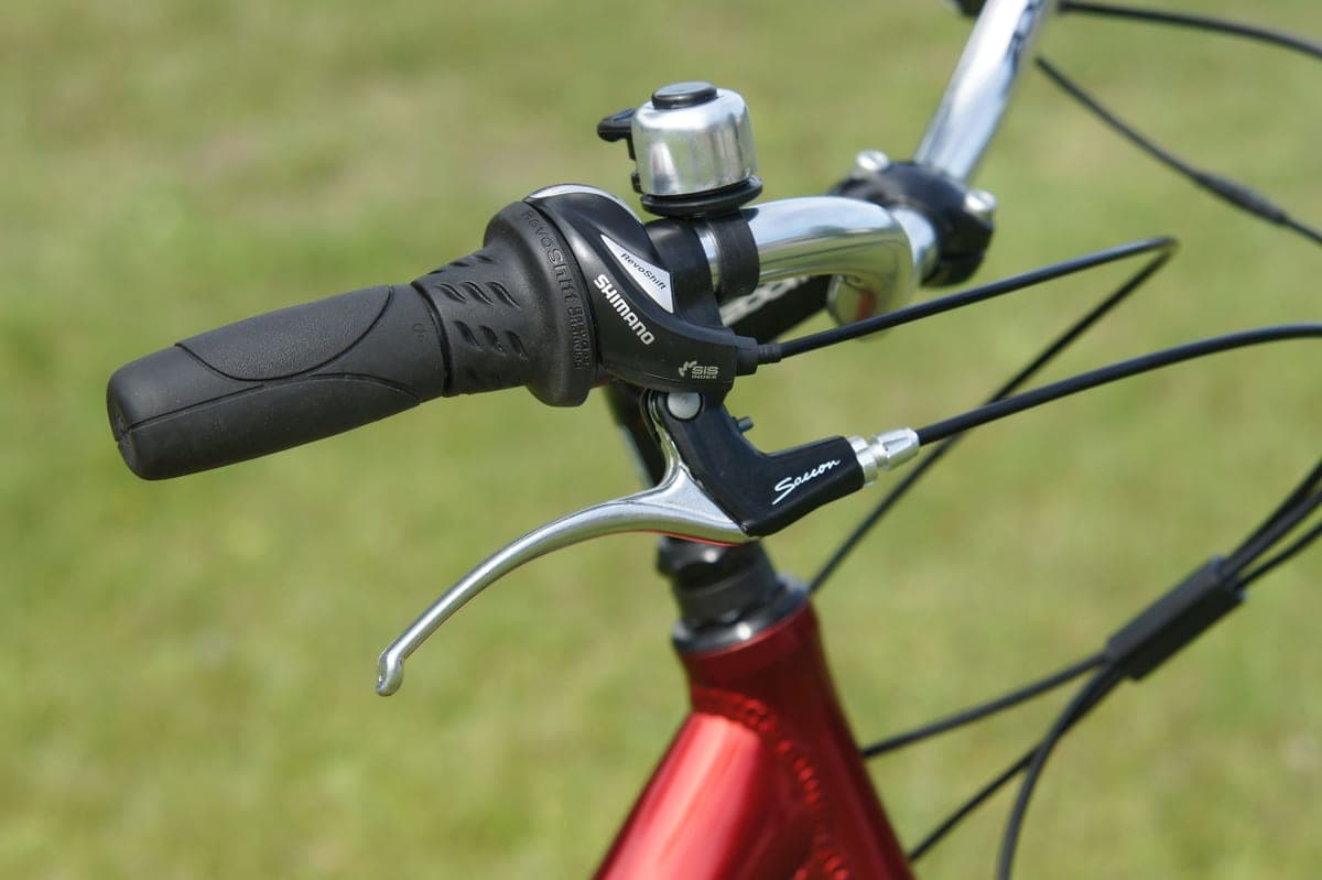 Close-up of a hand on a bicycle brake lever