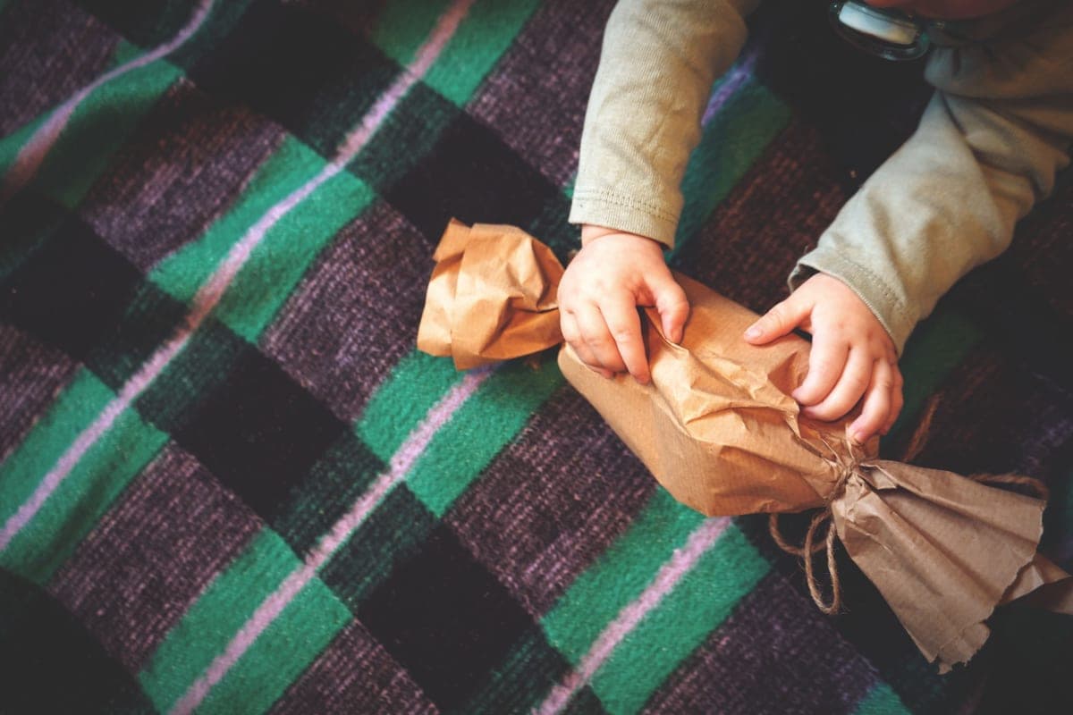 A wrapped gift being opened