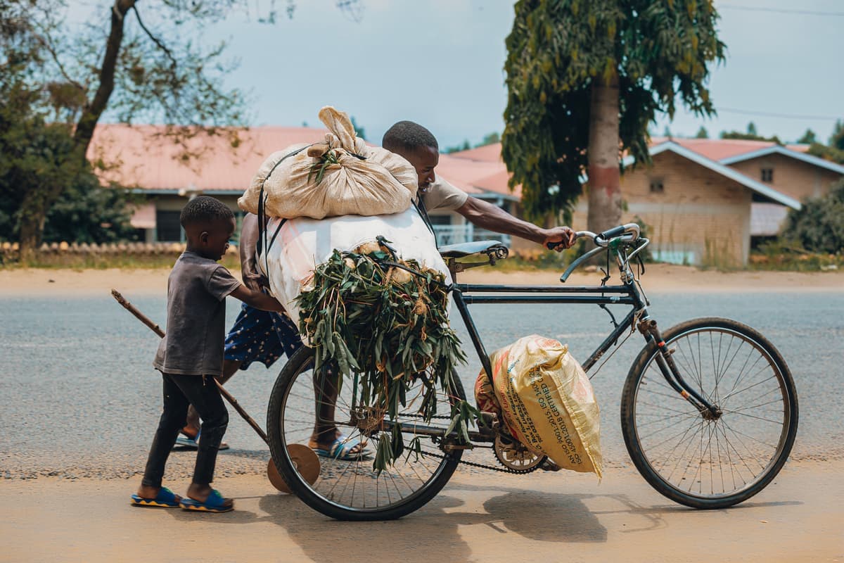 A person lifting a bicycle